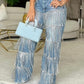 Damenjeans mit Pailletten und Quasten