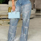 Damenjeans mit Pailletten und Quasten