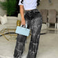 Damenjeans mit Pailletten und Quasten