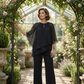 ✨ Elegantes zweiteiliges Set mit asymmetrischer mehrlagiger Bluse und weiter Hose. 🕊️