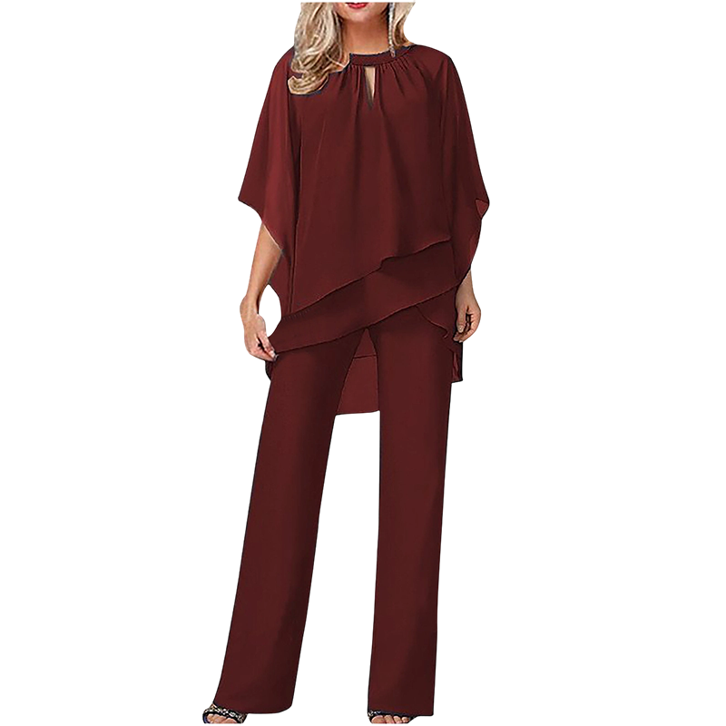 ✨ Elegantes zweiteiliges Set mit asymmetrischer mehrlagiger Bluse und weiter Hose. 🕊️